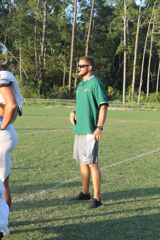 Nease coach Collin Drafts guides his team during a practice earlier this season.